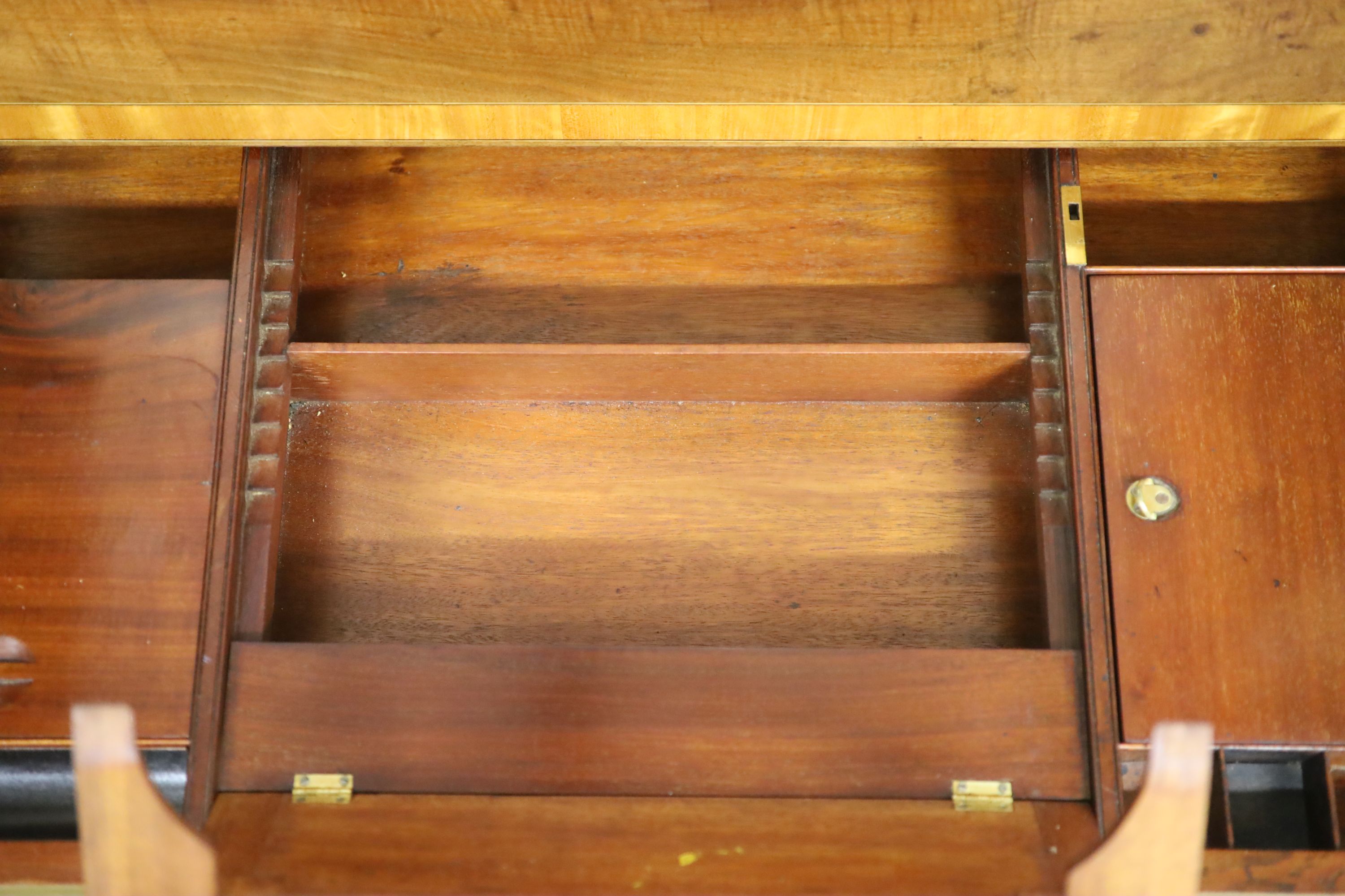 A Regency satin banded inlaid mahogany hinged top writing table, width 93cm depth 61cm height 75cm